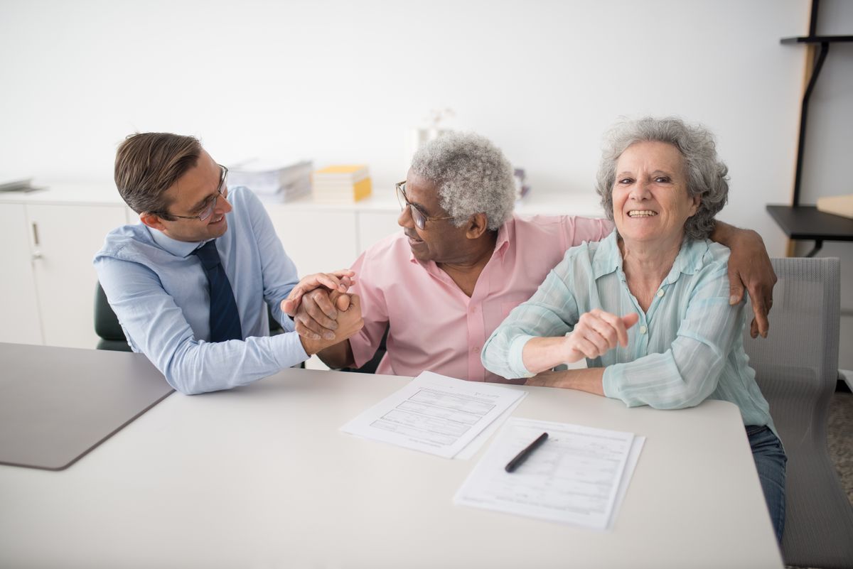 A CoverageForU insurance agent reviewing coverage options with a family